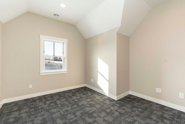 771 Zumbro Oaks Ln NW, Oronoco, MN 55960 - bonus room with dark carpet, baseboards, and vaulted ceiling