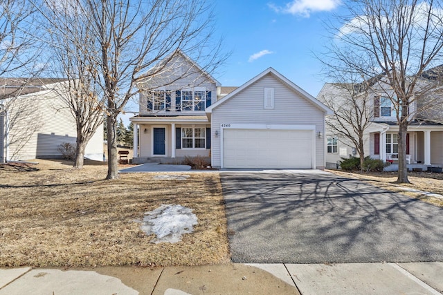 traditional-style home with a garage and driveway