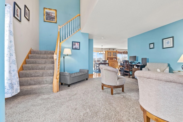 carpeted living room with stairs