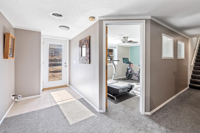 interior space featuring carpet flooring, visible vents, and ornamental molding