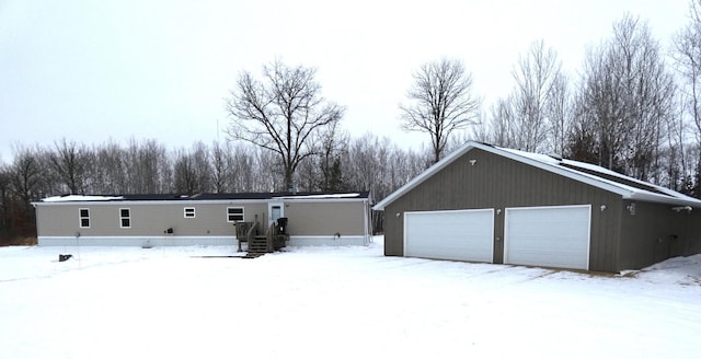 view of snow covered garage
