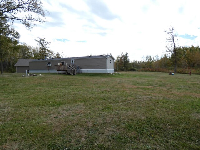 view of yard with a wooden deck