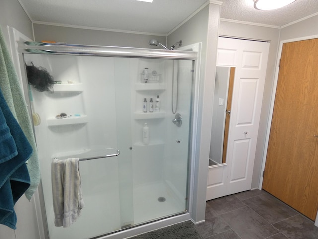 bathroom with walk in shower, crown molding, and a textured ceiling