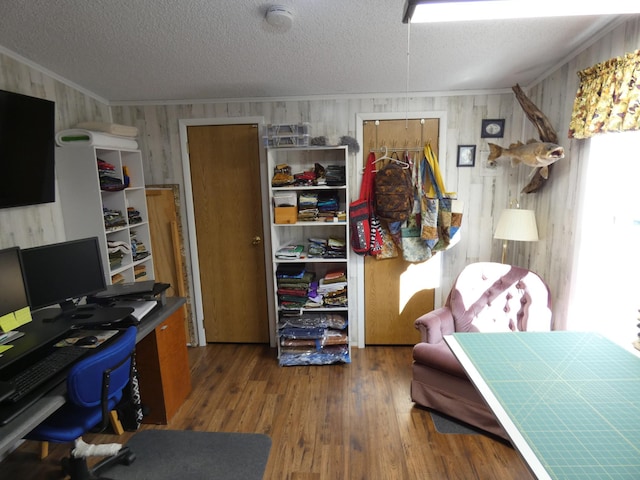 office with crown molding, dark wood-type flooring, and a textured ceiling