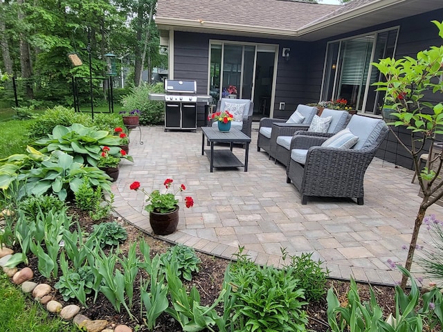 view of patio with grilling area and an outdoor living space