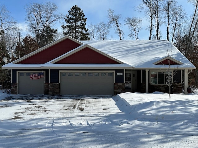 view of front of home featuring stone siding and an attached garage