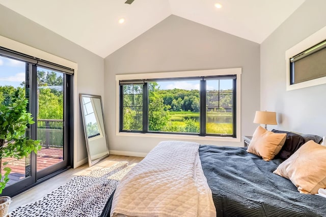 bedroom with lofted ceiling, multiple windows, and access to outside