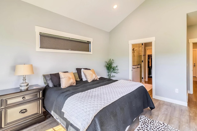 bedroom featuring lofted ceiling and light hardwood / wood-style floors