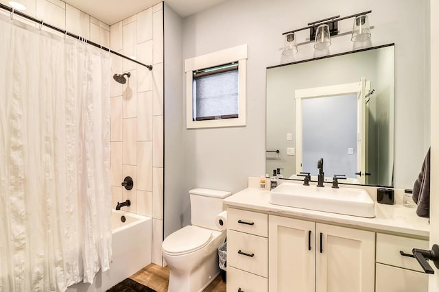 full bathroom featuring shower / tub combo, vanity, and toilet