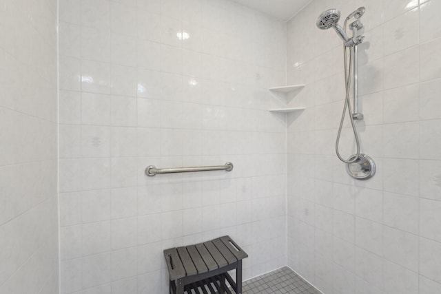 bathroom with a tile shower