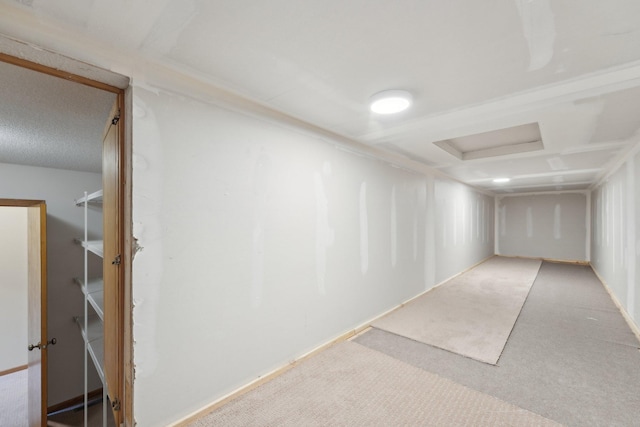 carpeted empty room featuring attic access