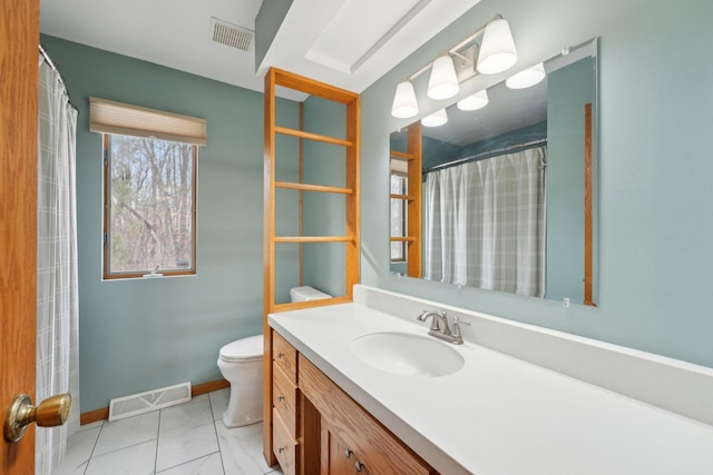 bathroom featuring visible vents, toilet, vanity, and baseboards