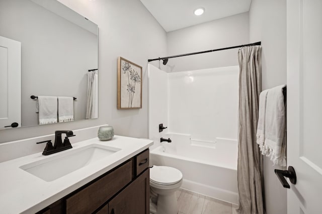 full bathroom with vanity, toilet, and shower / bath combo