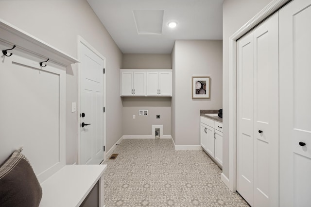 laundry room with cabinets, hookup for an electric dryer, and hookup for a washing machine