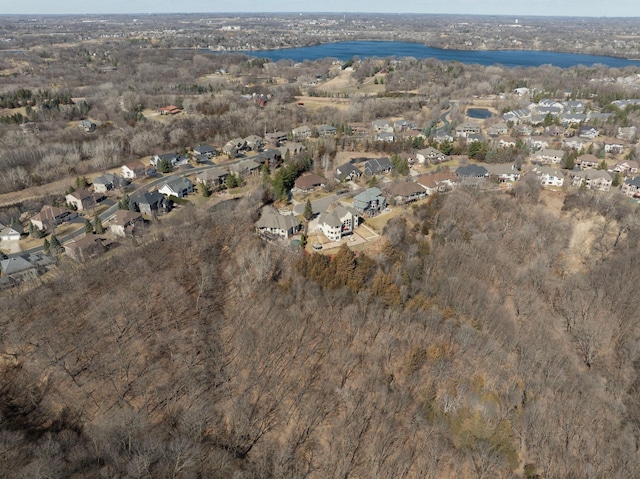 birds eye view of property with a residential view and a water view