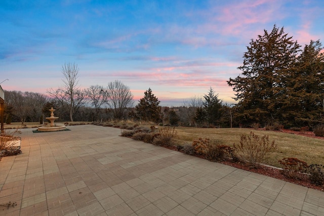 view of patio terrace at dusk
