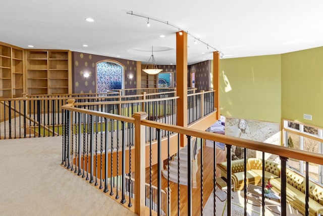 miscellaneous room featuring an upstairs landing, track lighting, carpet, visible vents, and recessed lighting
