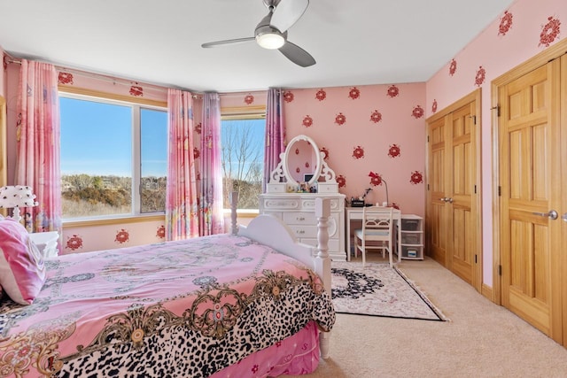 carpeted bedroom featuring a ceiling fan
