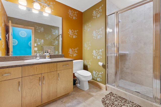 full bath featuring baseboards, toilet, vanity, and a stall shower