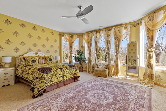 bedroom featuring wallpapered walls, carpet, access to exterior, a ceiling fan, and baseboards