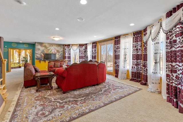 living area with carpet flooring, recessed lighting, and a textured ceiling