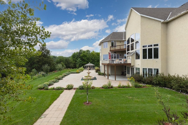 surrounding community featuring a patio area and a lawn