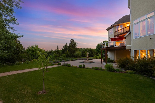 19115 Vogel Farm Trl, Eden Prairie, MN 55347 - yard at dusk with a balcony, a yard, and a patio area