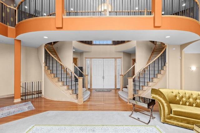 19115 Vogel Farm Trl, Eden Prairie, MN 55347 - entrance foyer with a high ceiling, wood finished floors, and stairway