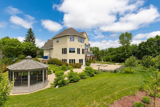 19115 Vogel Farm Trl, Eden Prairie, MN 55347 - back of property with a gazebo, a lawn, a patio, and stucco siding
