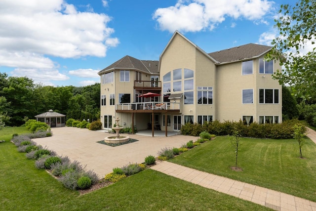 19115 Vogel Farm Trl, Eden Prairie, MN 55347 - rear view of property with a yard, stucco siding, a patio, and a deck
