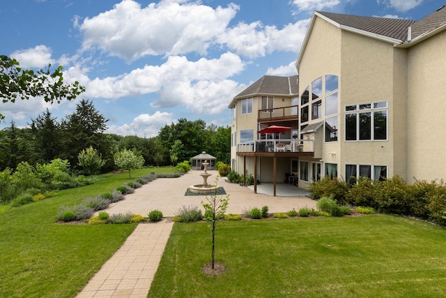 19115 Vogel Farm Trl, Eden Prairie, MN 55347 - view of grassy yard with a patio area and a balcony