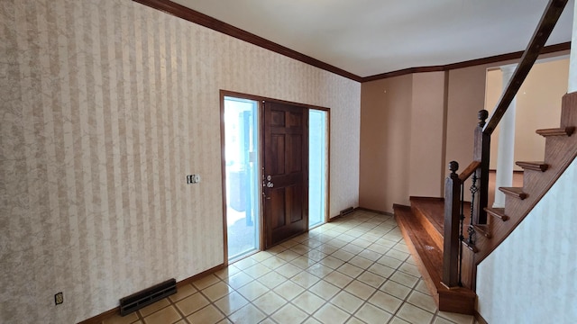 tiled entrance foyer with crown molding