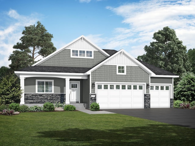 craftsman house featuring a garage and a front yard