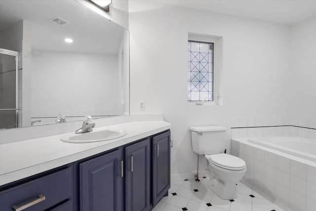 full bathroom with vanity, tile patterned flooring, independent shower and bath, and toilet