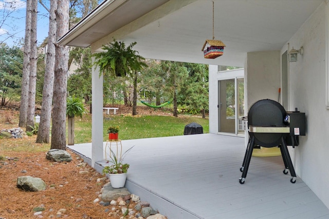 view of patio with a wooden deck and area for grilling