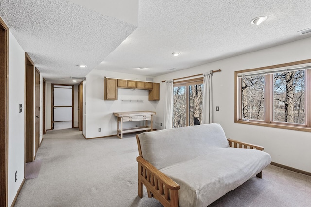 sitting room with recessed lighting, visible vents, light carpet, a textured ceiling, and baseboards