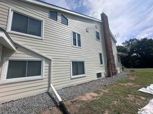 view of side of home with a chimney