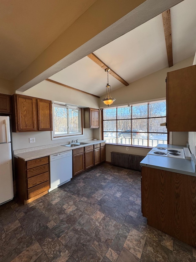 kitchen with white appliances, a sink, beam ceiling, brown cabinets, and radiator