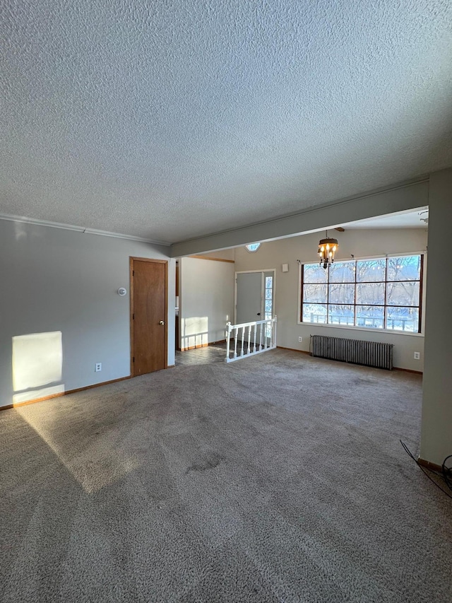 unfurnished living room with a notable chandelier, a textured ceiling, carpet flooring, and radiator