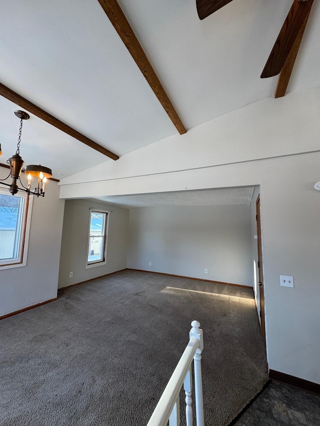 unfurnished room featuring carpet floors, an inviting chandelier, baseboards, and beamed ceiling