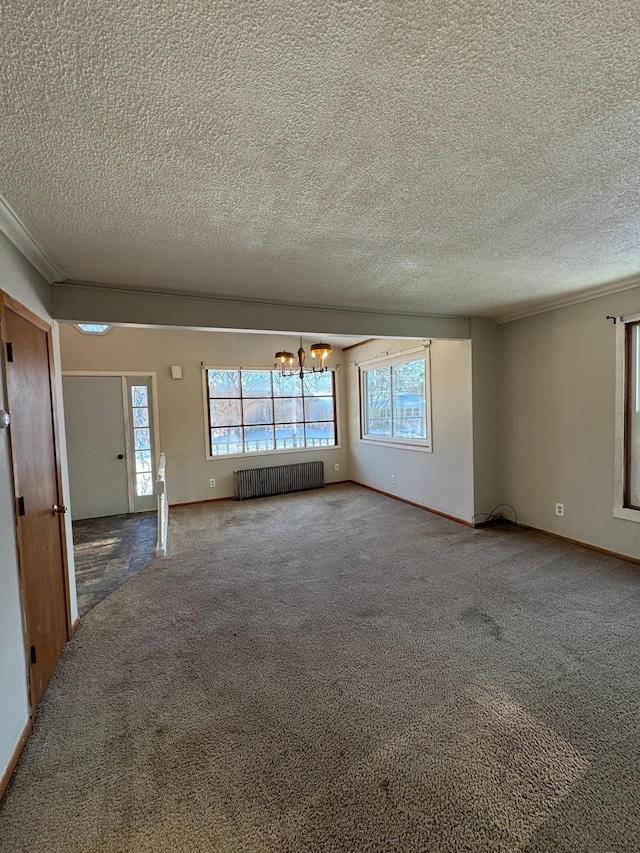 empty room featuring carpet floors, baseboards, radiator heating unit, and an inviting chandelier