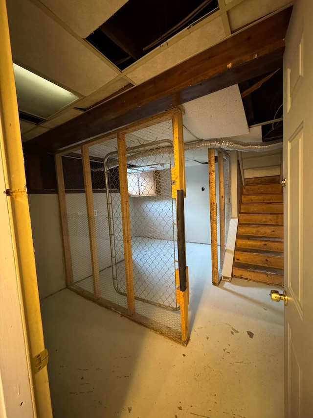 unfinished basement featuring stairway