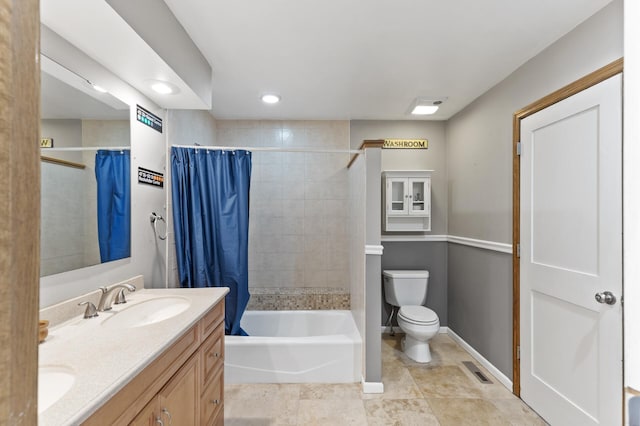 full bathroom featuring double vanity, visible vents, toilet, shower / tub combo, and a sink