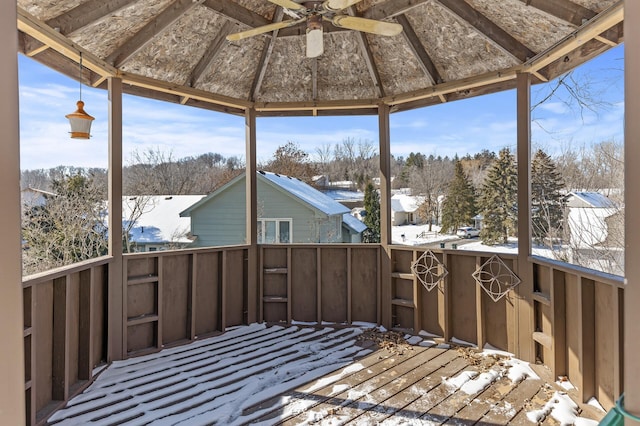 snow covered deck with ceiling fan and a gazebo