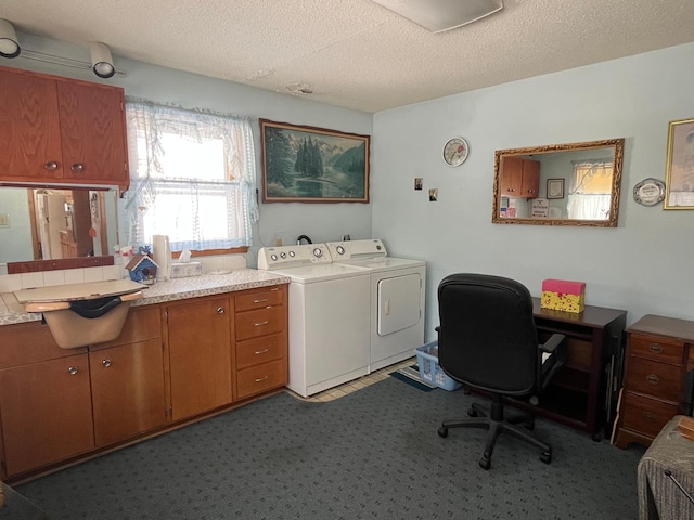 home office featuring washing machine and dryer and a textured ceiling