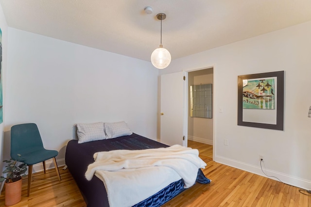 bedroom with hardwood / wood-style flooring