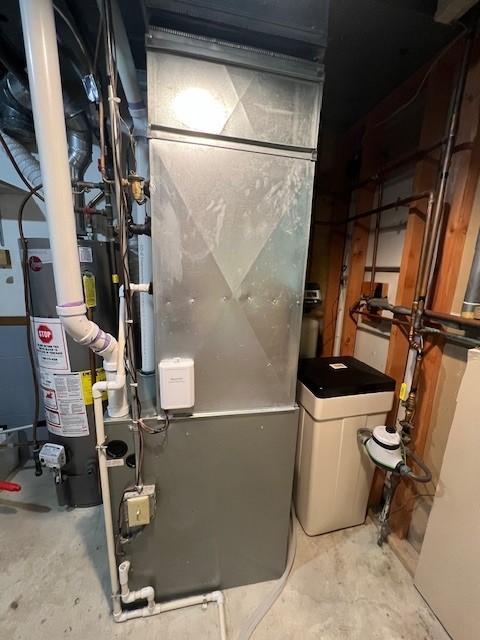 utility room featuring gas water heater