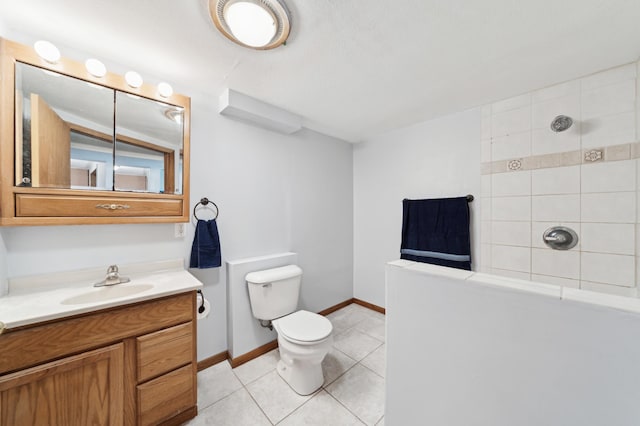 full bathroom featuring toilet, tile patterned flooring, tiled shower, and vanity