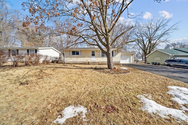 view of front of property featuring driveway and an attached garage