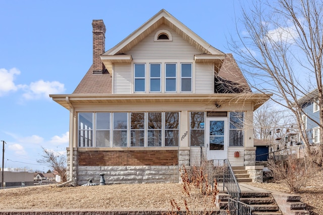 view of front of property featuring a chimney